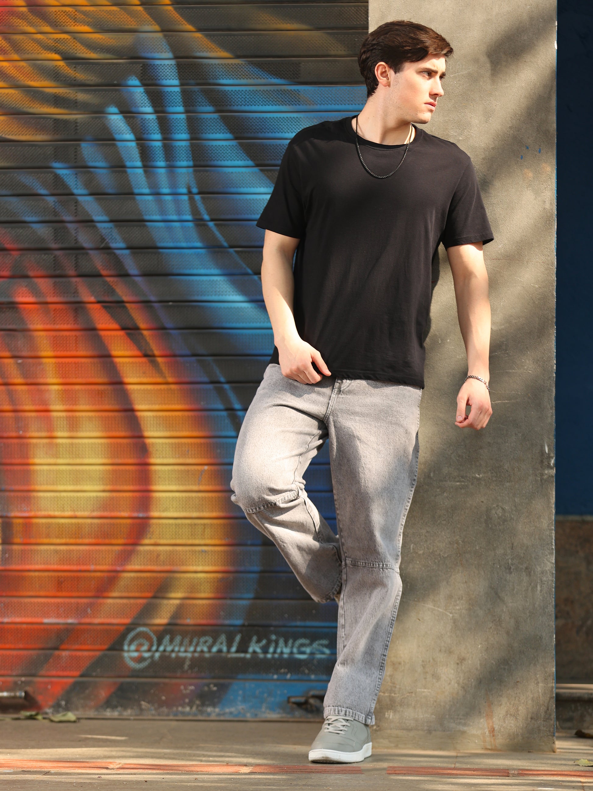 Trendy men's grey denim pants with classic five pocket design