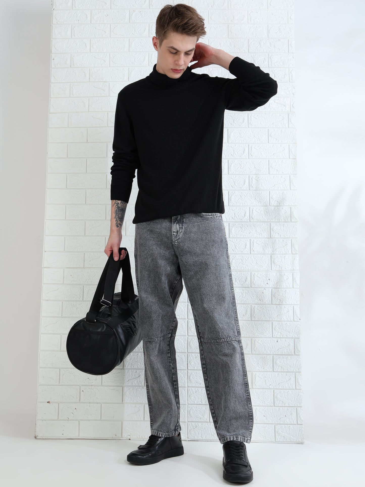 Stylish men's grey jeans with relaxed fit and faded wash finish