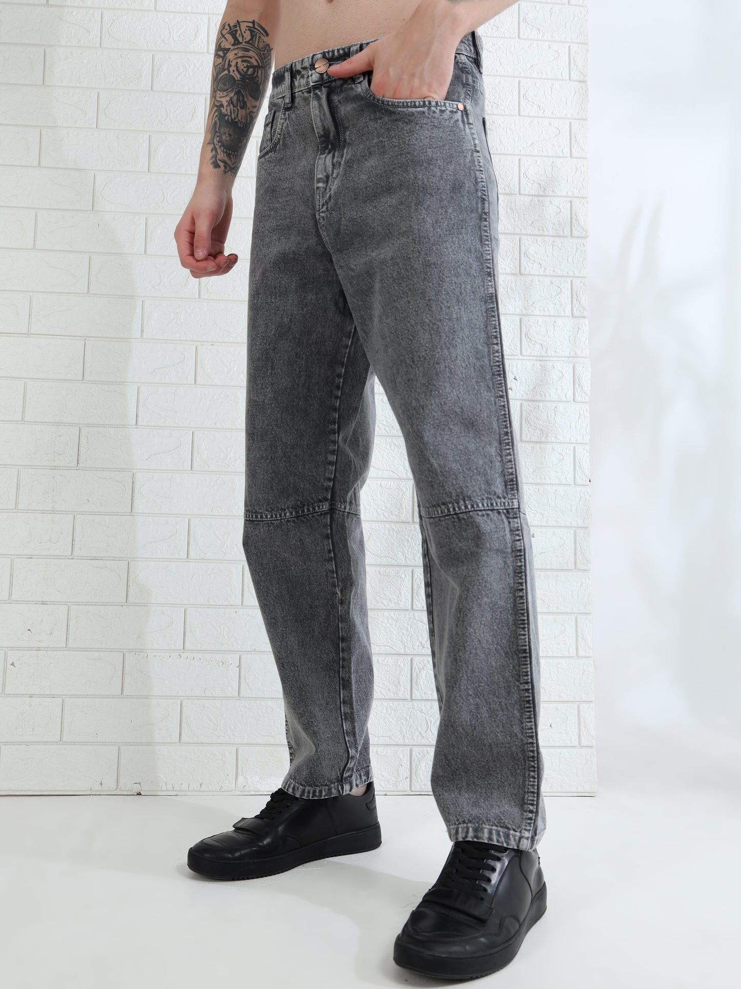 Fashionable men's straight leg grey jeans with subtle fade detailing