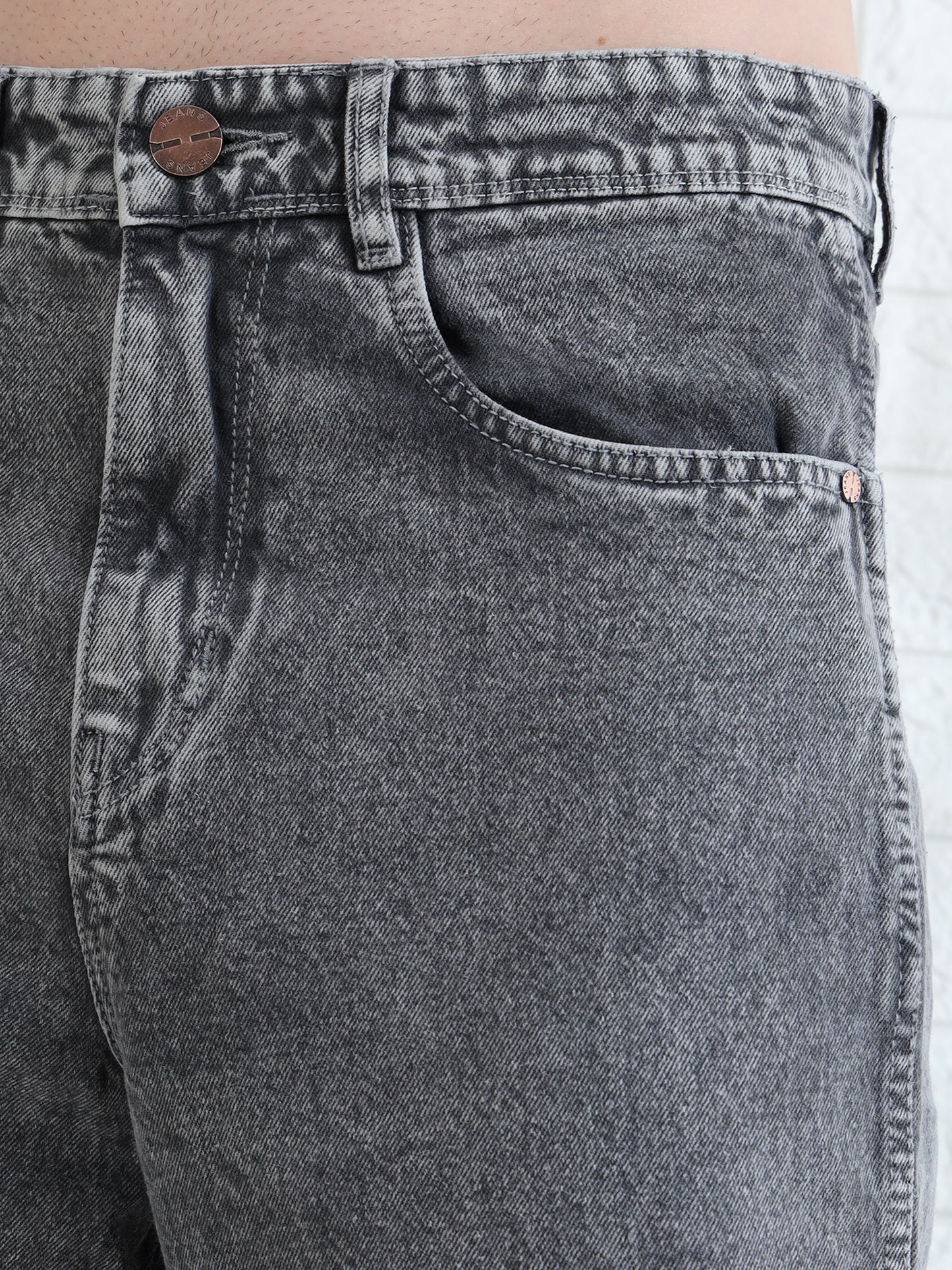 Stylish men's grey jeans with relaxed fit and faded wash finish