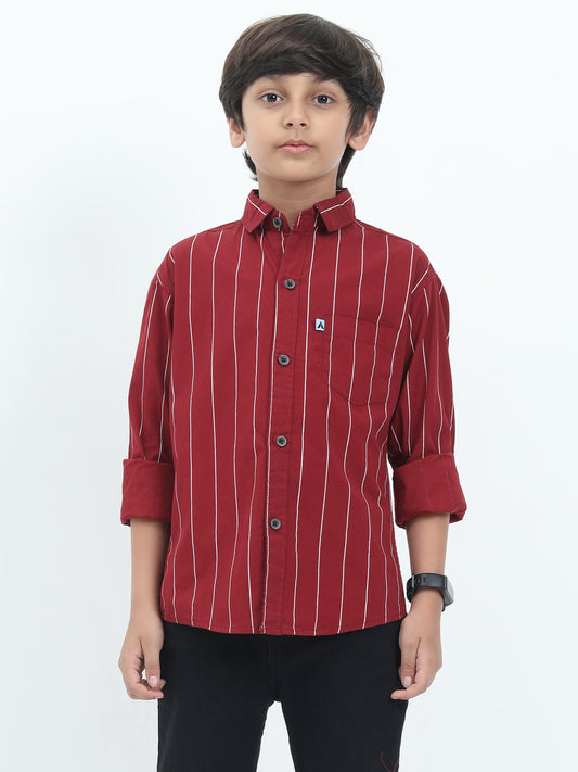 Child wearing a red striped shirt on a white background