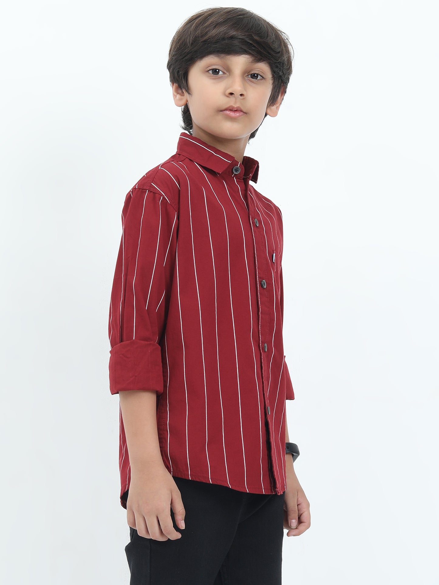 Child wearing a red striped shirt on a white background