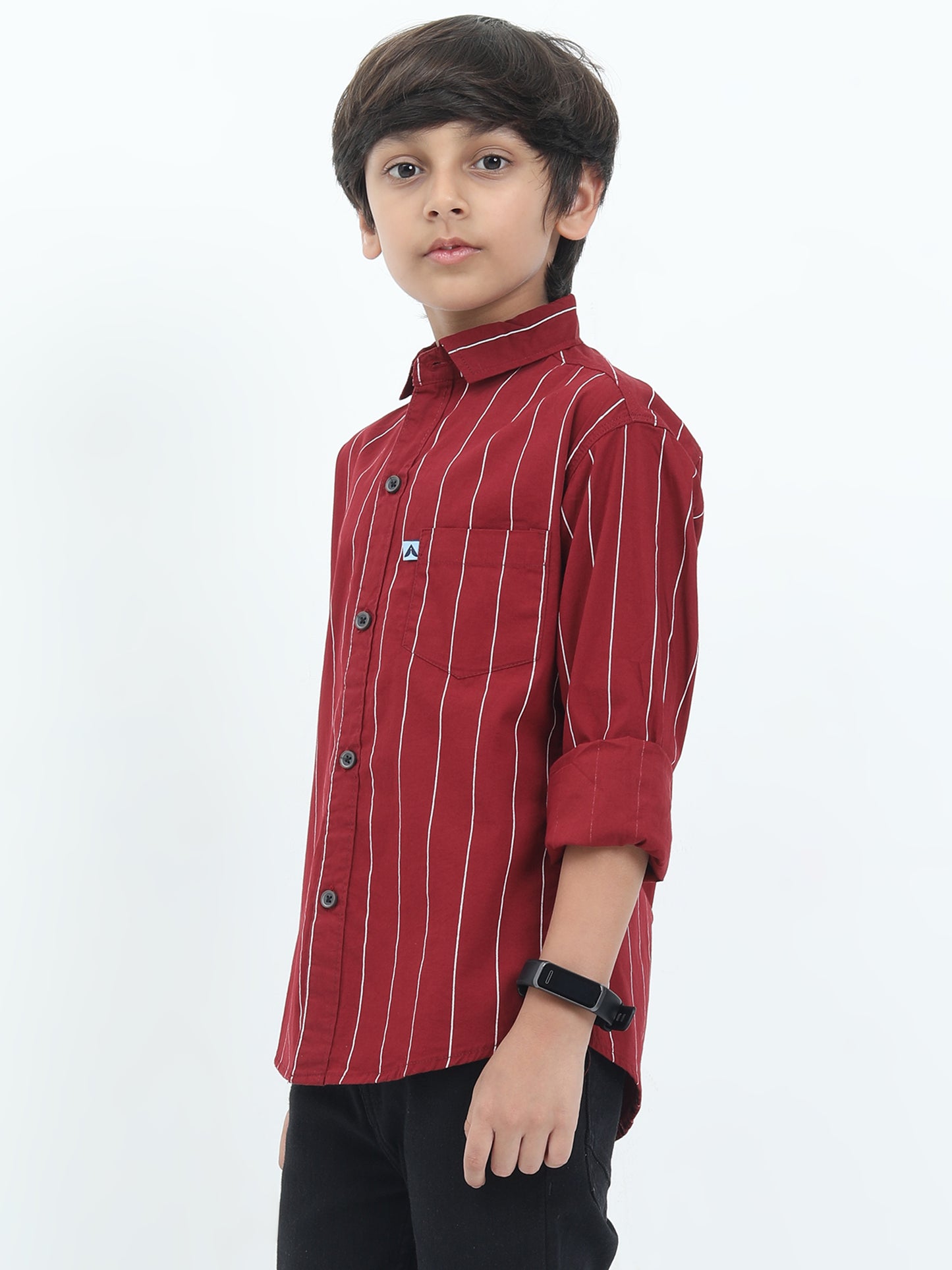 Child wearing a red striped shirt on a white background