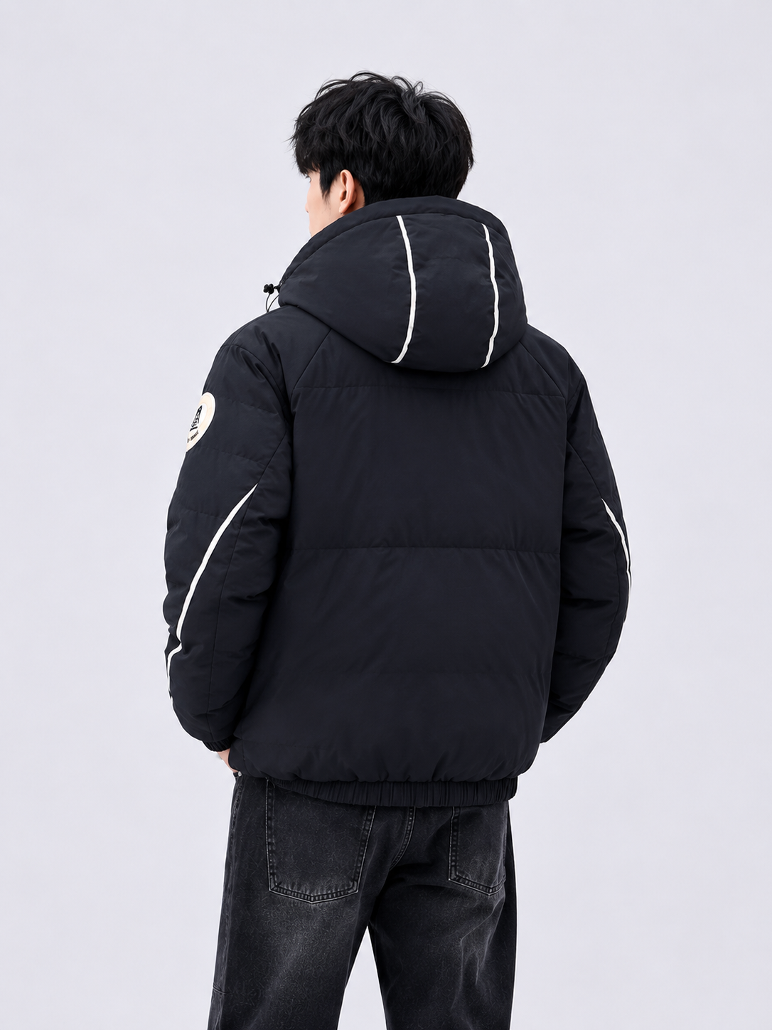 men's black hooded winter puffer jacket with padded construction, elastic hem, contrast hood detailing, and full sleeves for cold-weather protection.