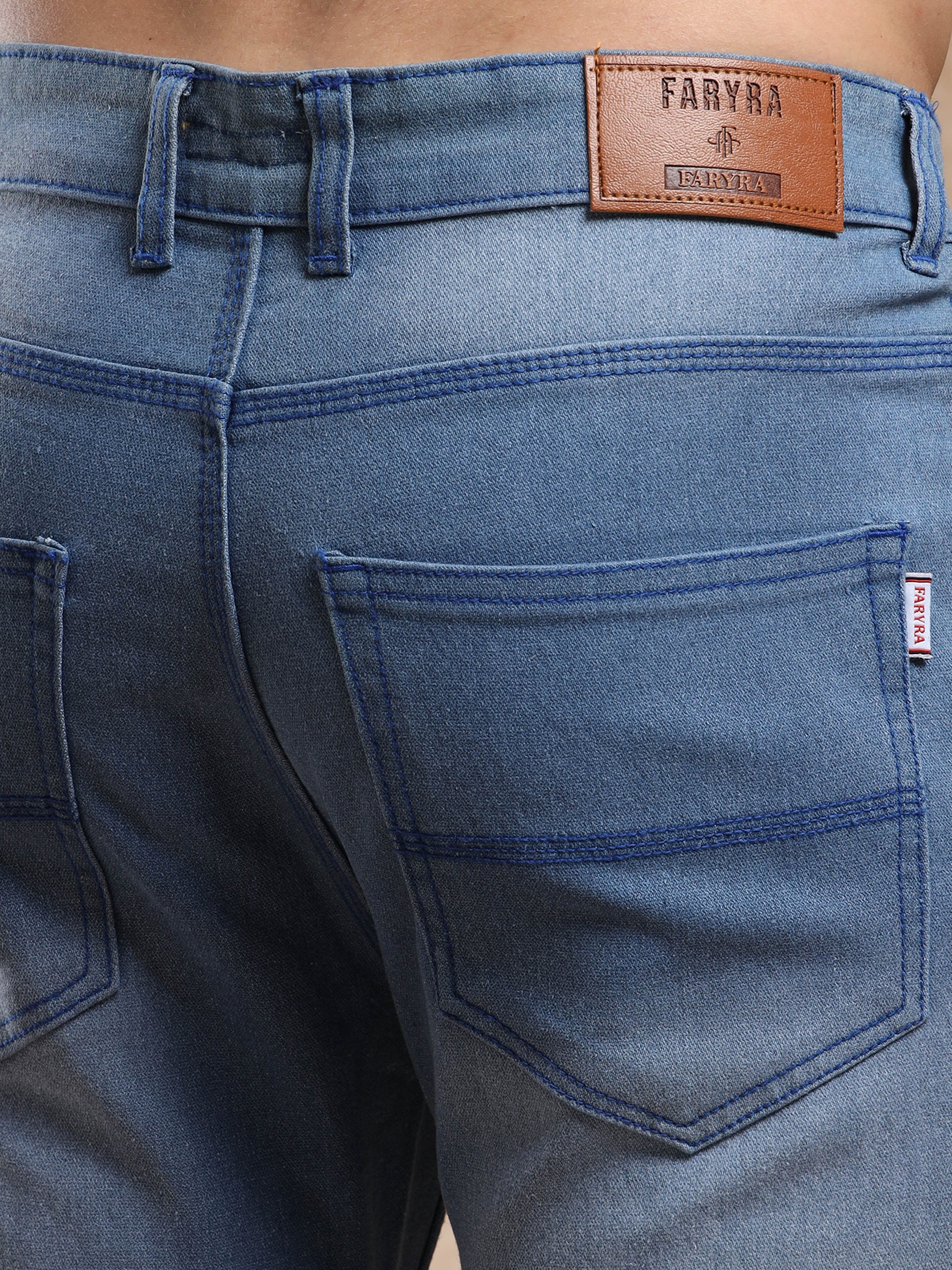 Branded men, denim jeans with leather patch and stitched back pockets.