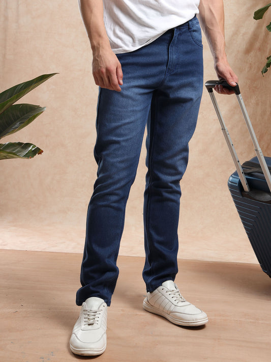 Men slim fit mid blue denim jeans styled with printed shirt and sneakers  casual wear look