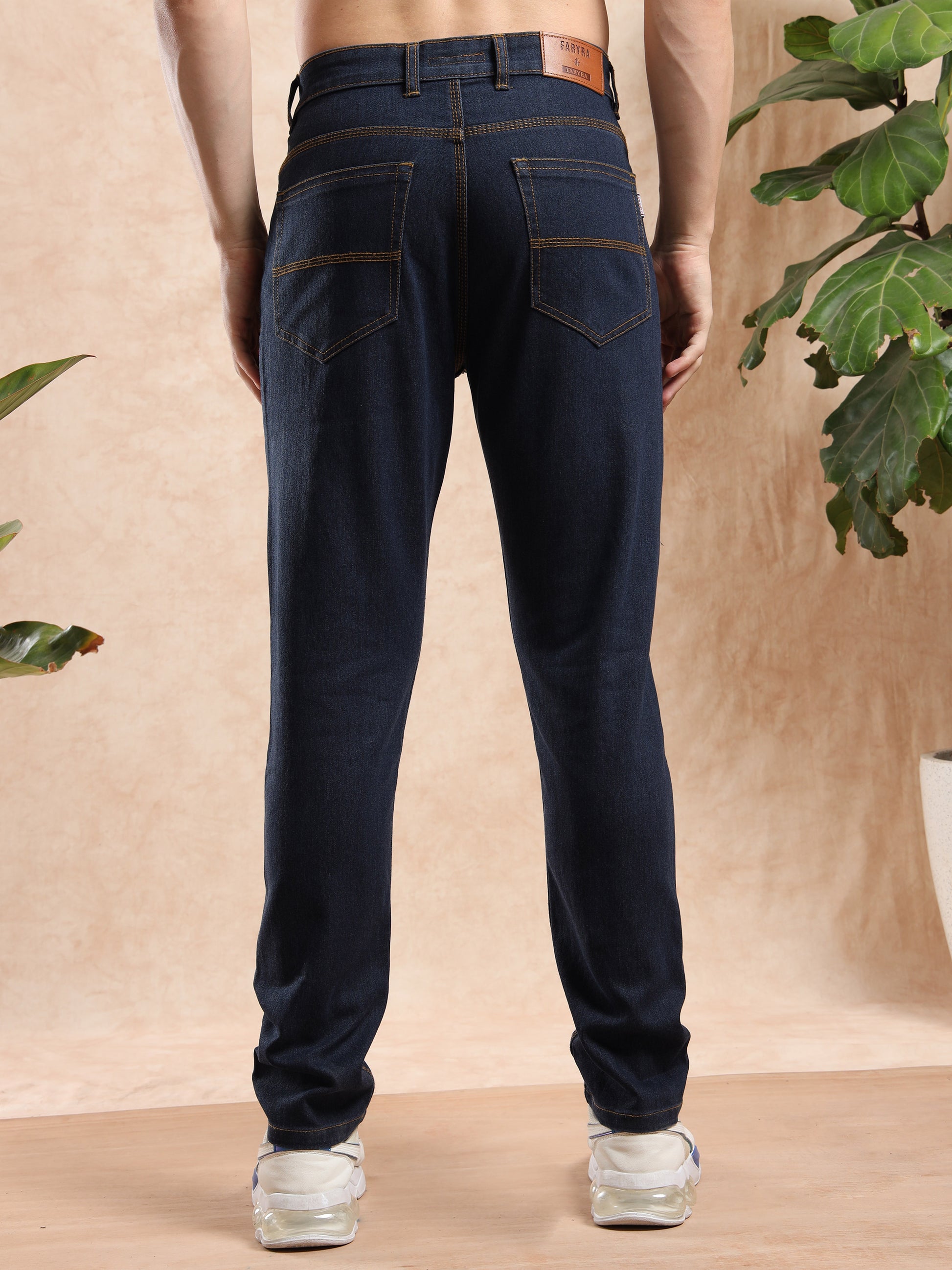men, dark blue slim fit jeans with leather brand patch