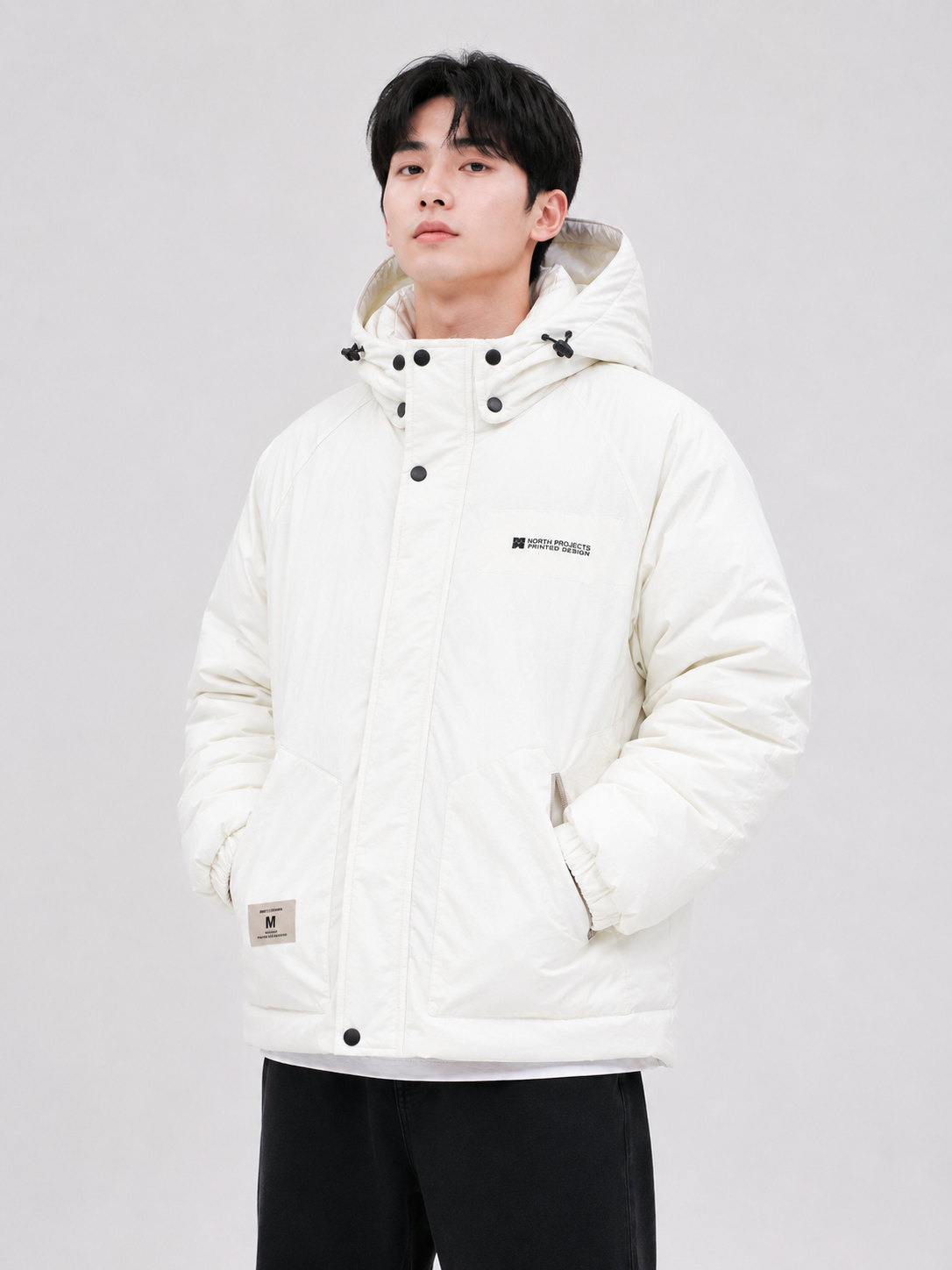 Men's white hooded puffer jacket with insulated padding, high-neck snap button closure, full sleeves, and side pockets
