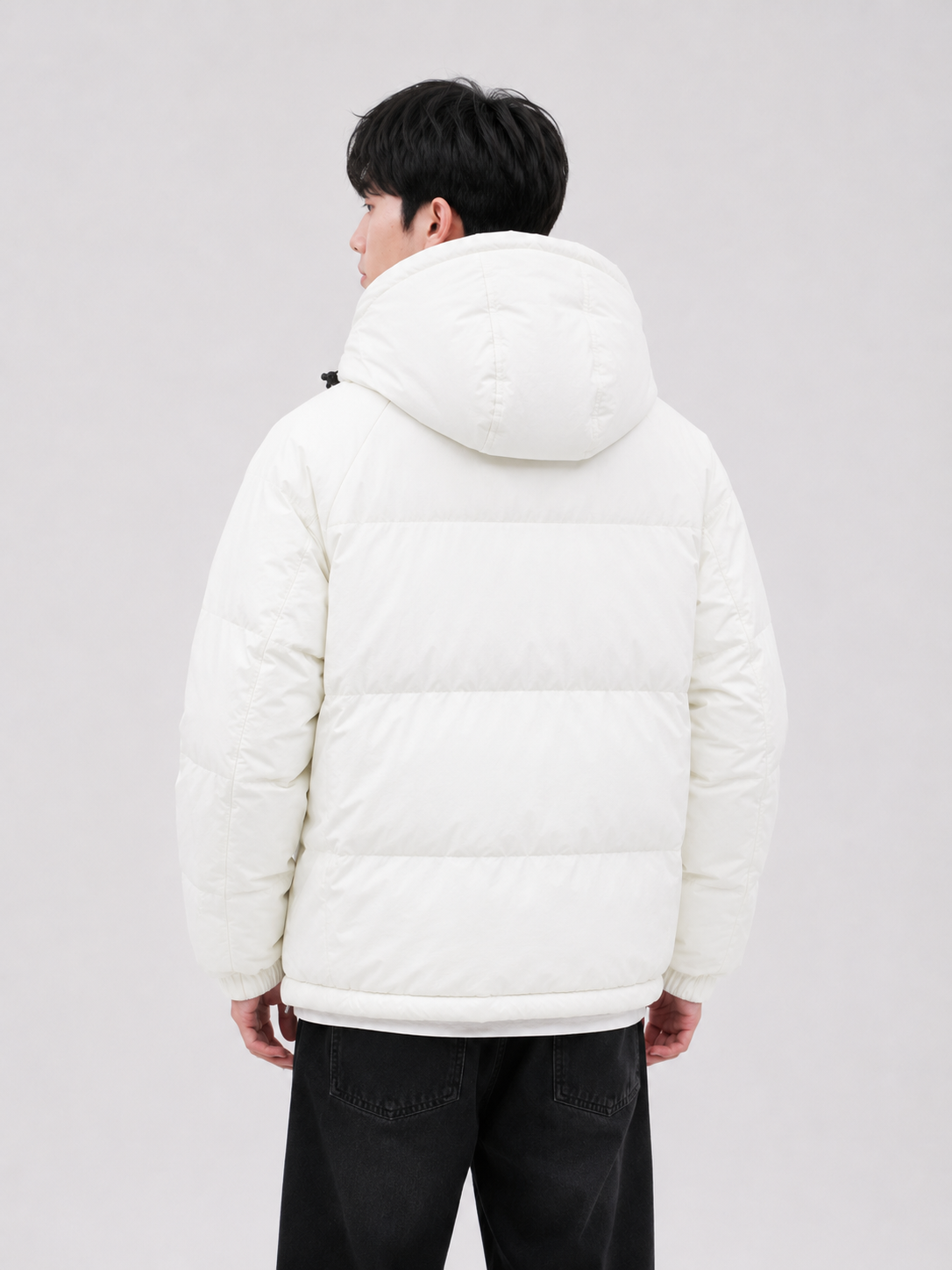 a men's white insulated puffer jacket featuring a padded hood, quilted construction, and clean minimalist design for cold-weather comfort and style.