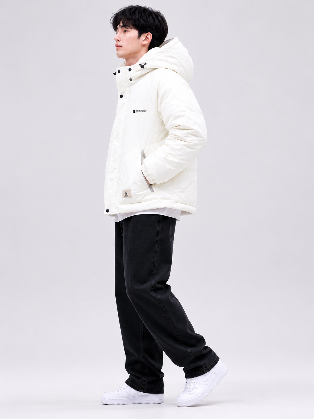 a men's white hooded winter jacket with thick insulation, adjustable hood, relaxed fit, and practical side pockets