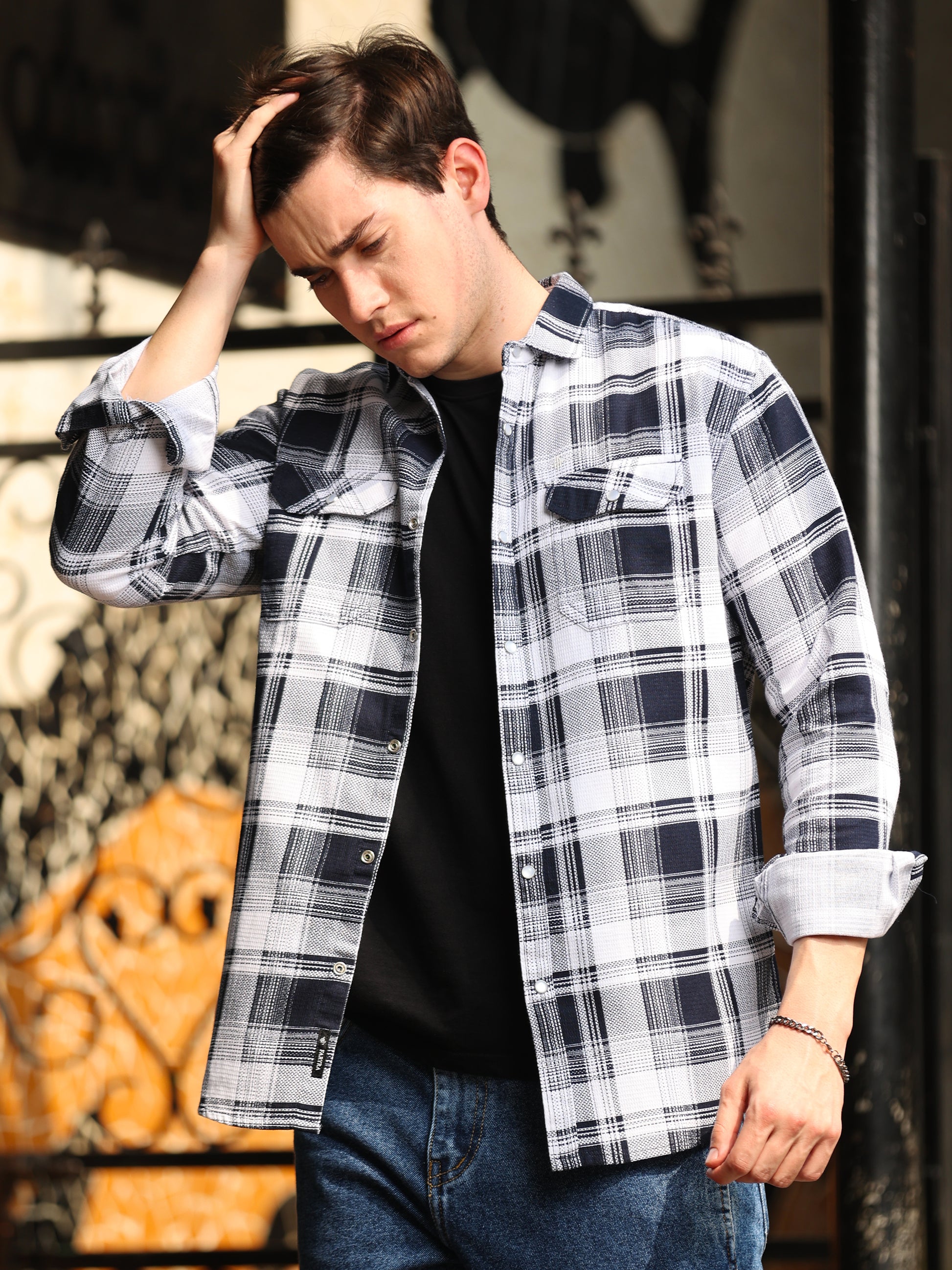 Men's black and white check shirt with full sleeves and layered casual look