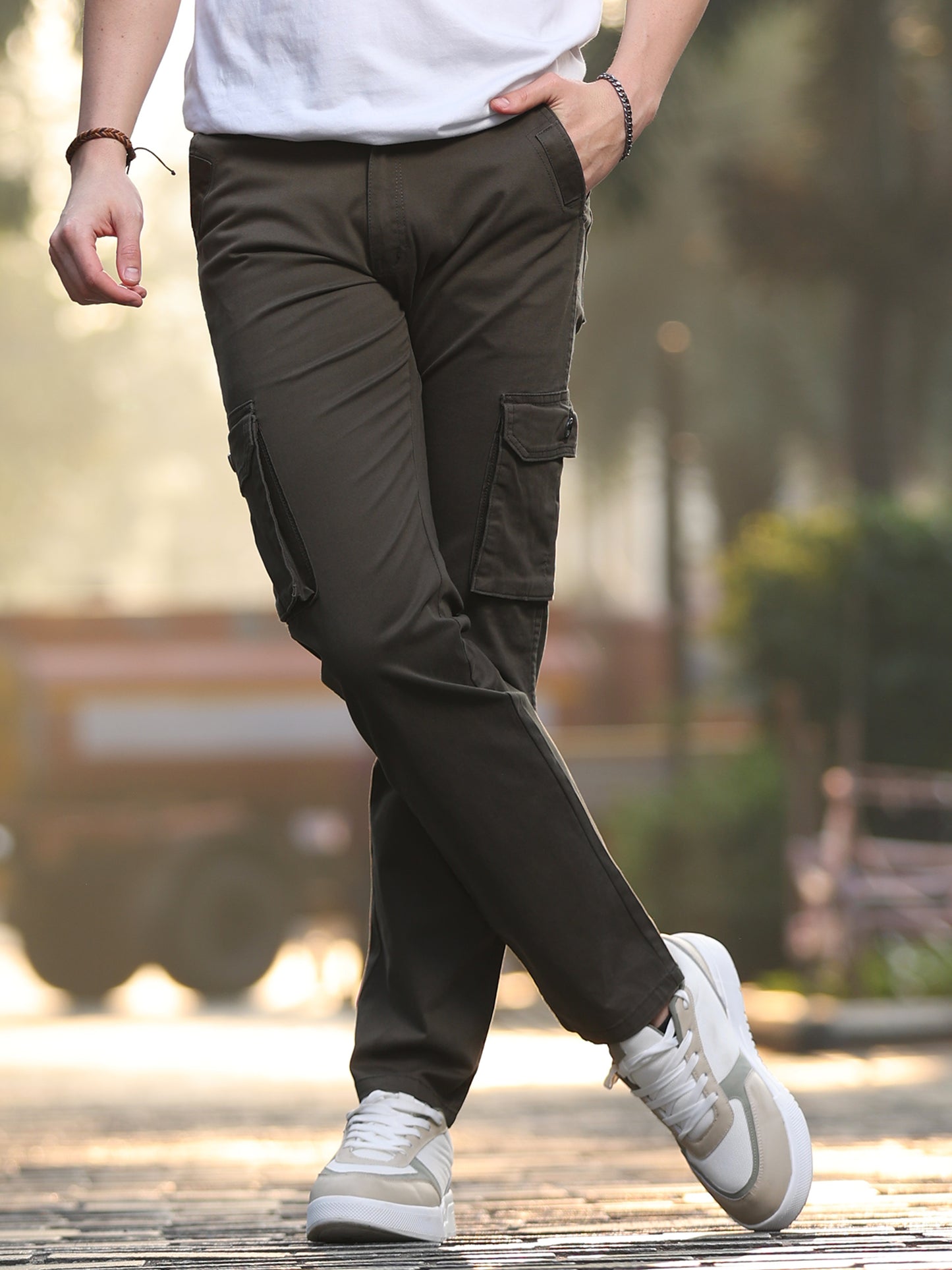 Men's olive green cotton cargo pants with side flap pockets and straight fit