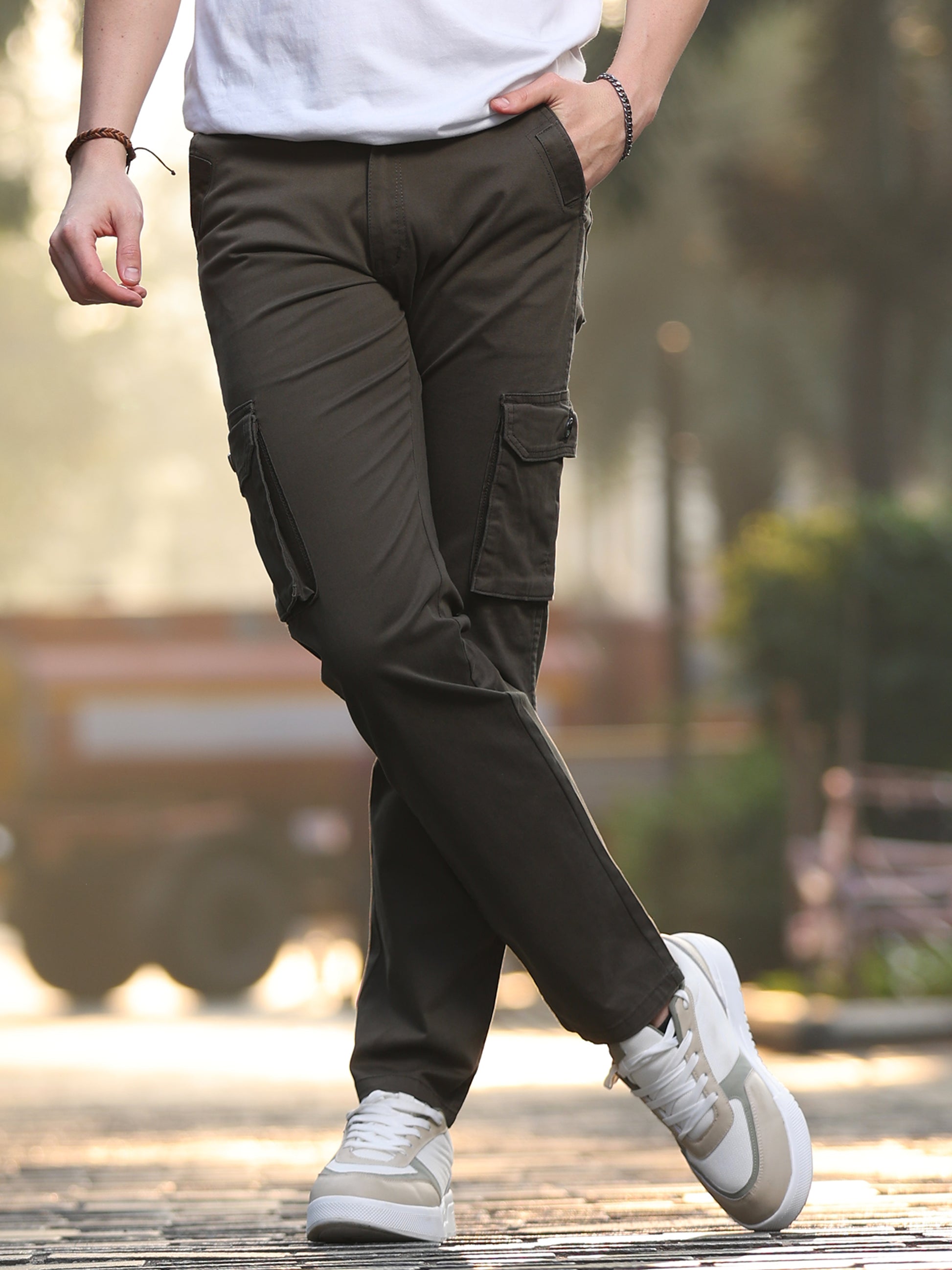 Men's olive green cotton cargo pants with side flap pockets and straight fit