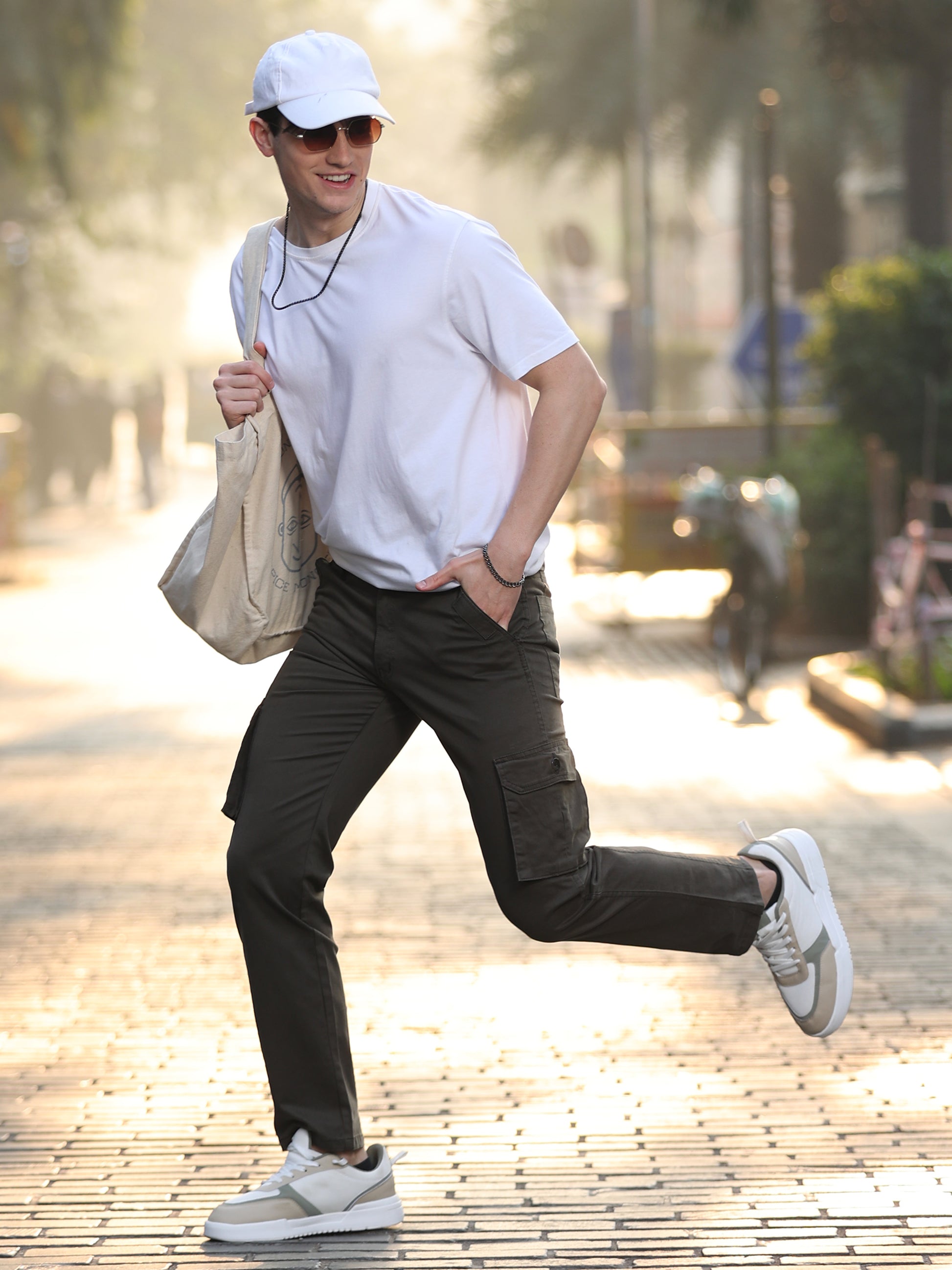 Stylish men's olive cargo trousers with utility pockets and modern slim design