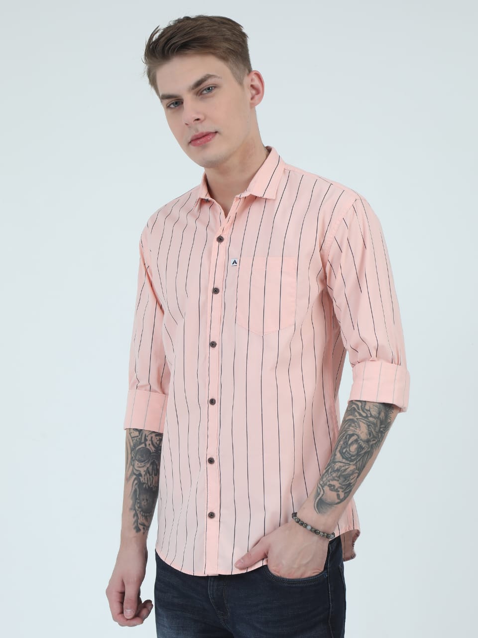 Man wearing a pink striped shirt on a white background