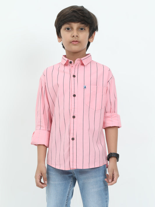 Child wearing a pink striped shirt and blue jeans on a white background