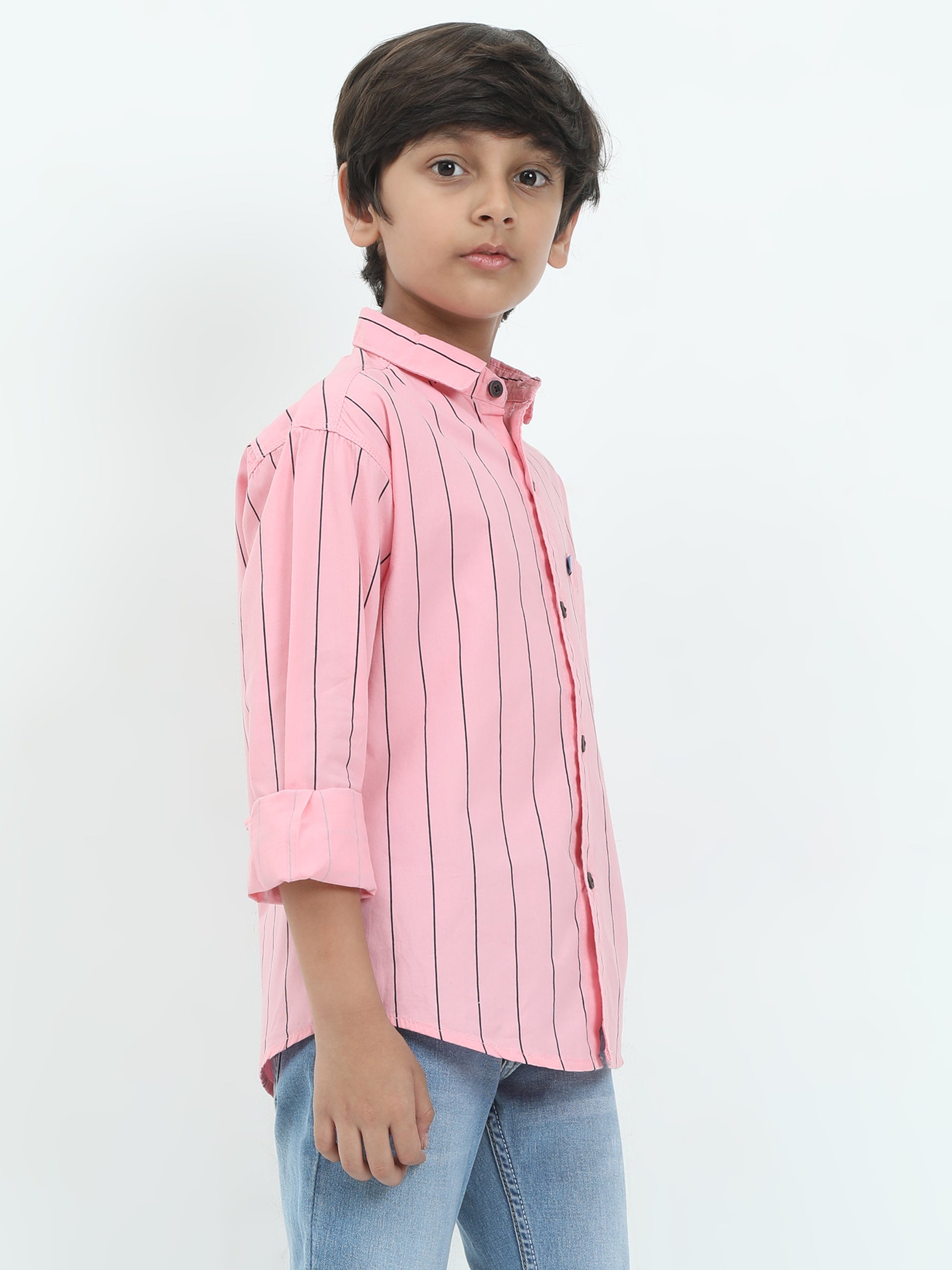 Child wearing a pink striped shirt on a white background
