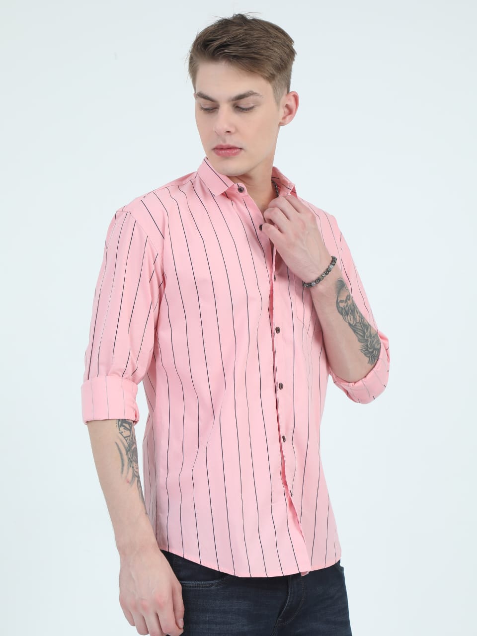 Man wearing a pink striped shirt on a white background
