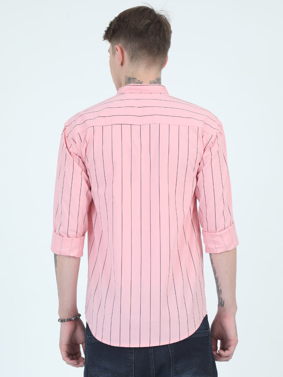 Person wearing a pink striped shirt on a white background
