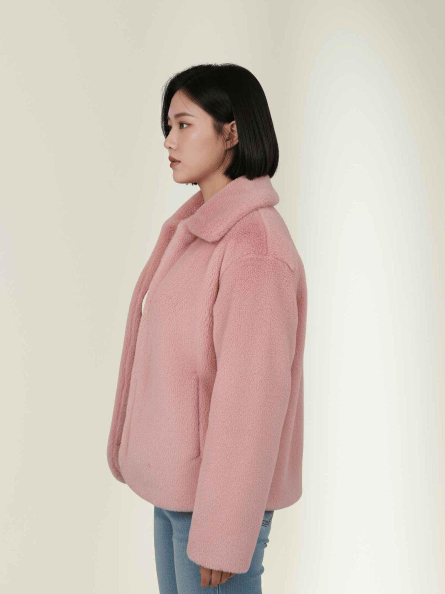a pink RABBIT fur jacket with a white top and high-waist black jeans