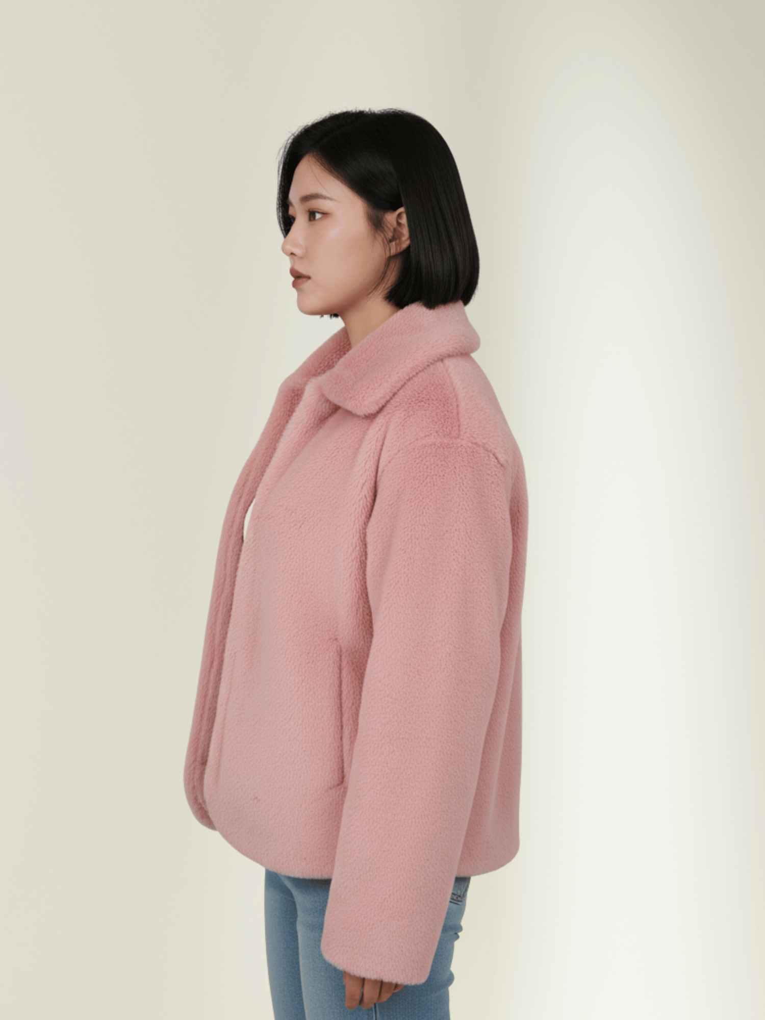 a pink RABBIT fur jacket with a white top and high-waist black jeans