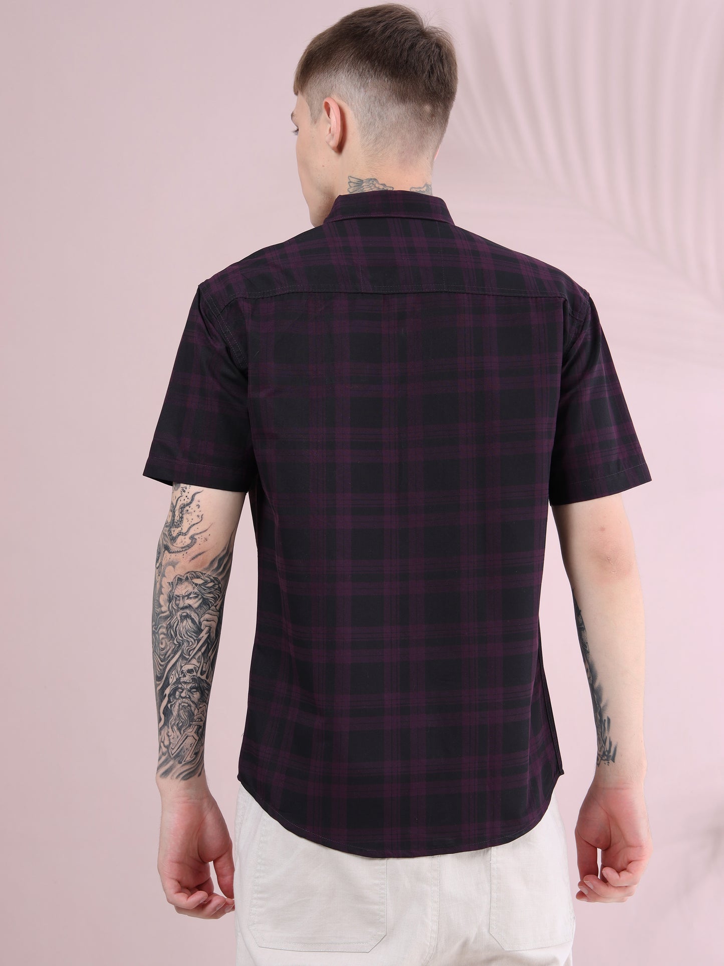 Back view of men, purple and black checkered short sleeve shirt, casual style