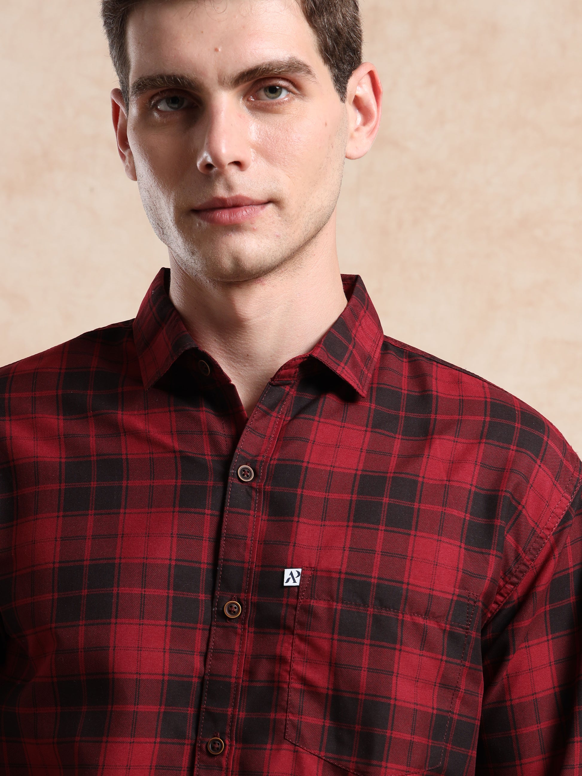 men, red and black checkered shirt with button-down collar and pocket logo detail.
