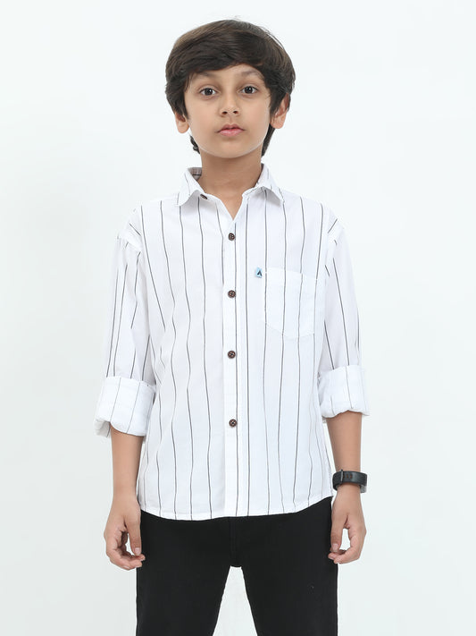 Child wearing a white striped shirt on a white background