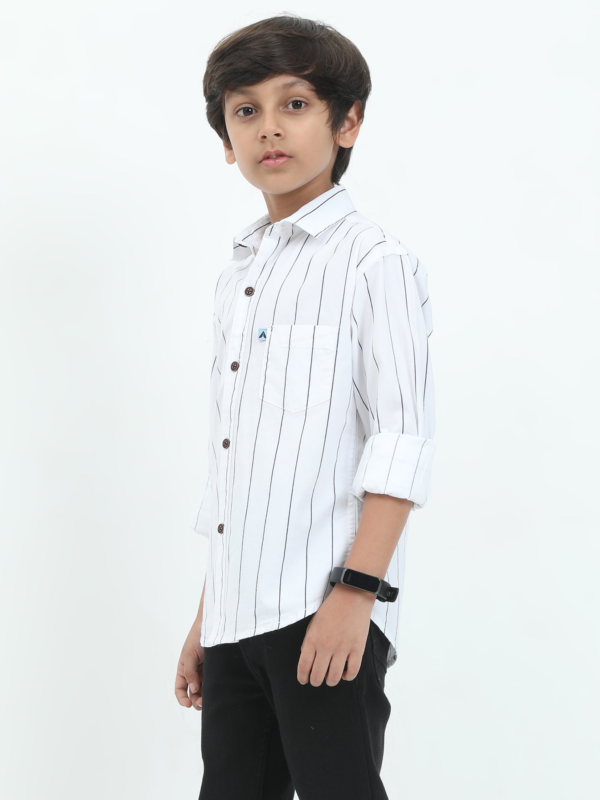 Young boy wearing a white striped shirt on a white background