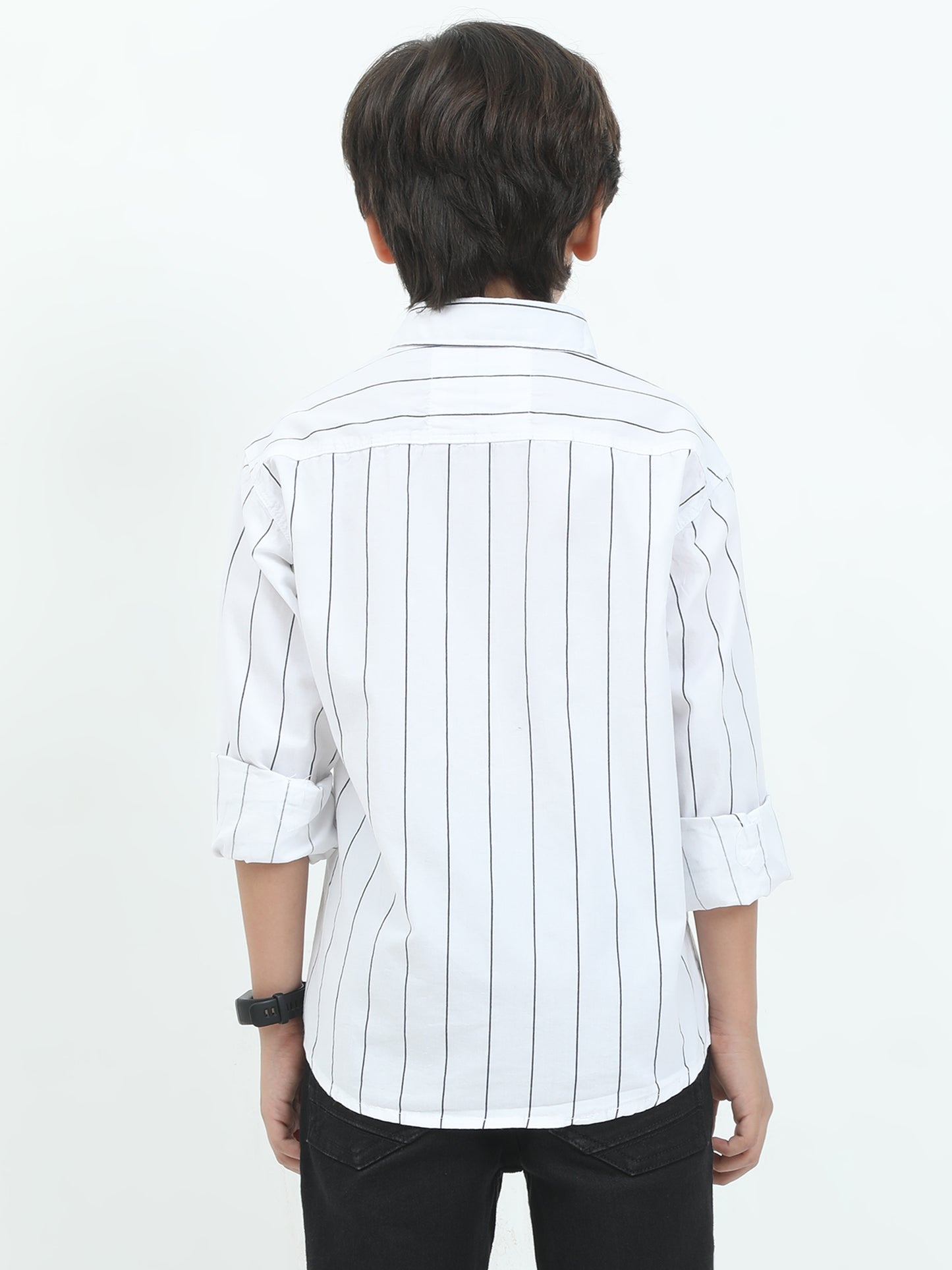 Person wearing a white shirt with black vertical stripes on a white background