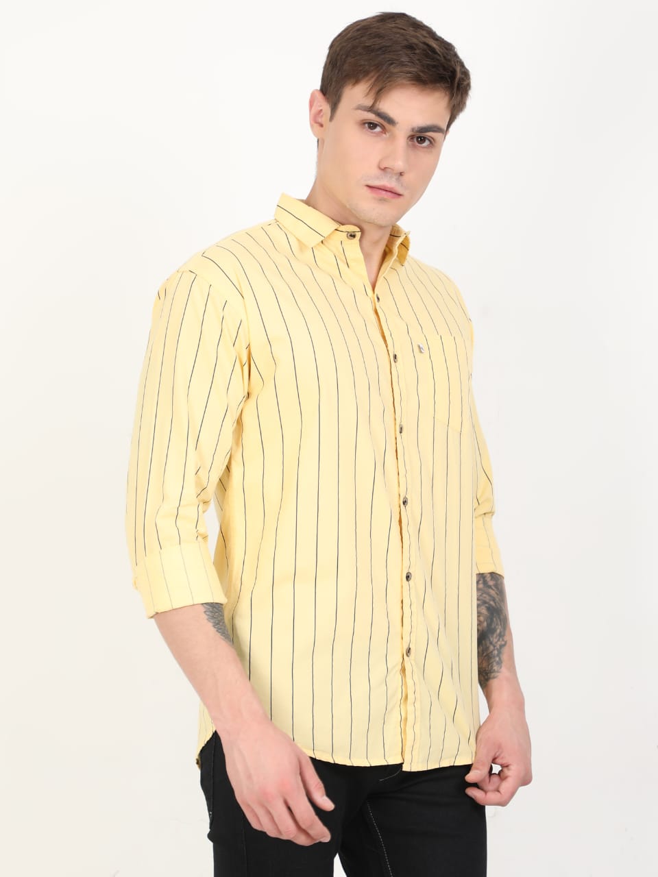 Man wearing a yellow striped shirt on a white background